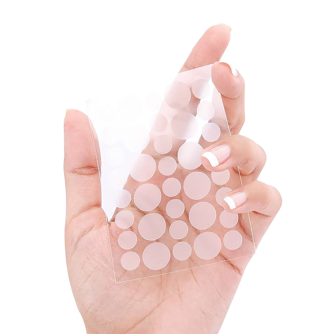 Model holding Acne Patches in hand